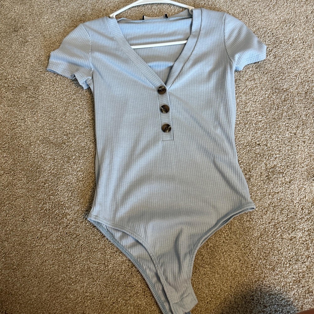 Light blue body suit with buttons